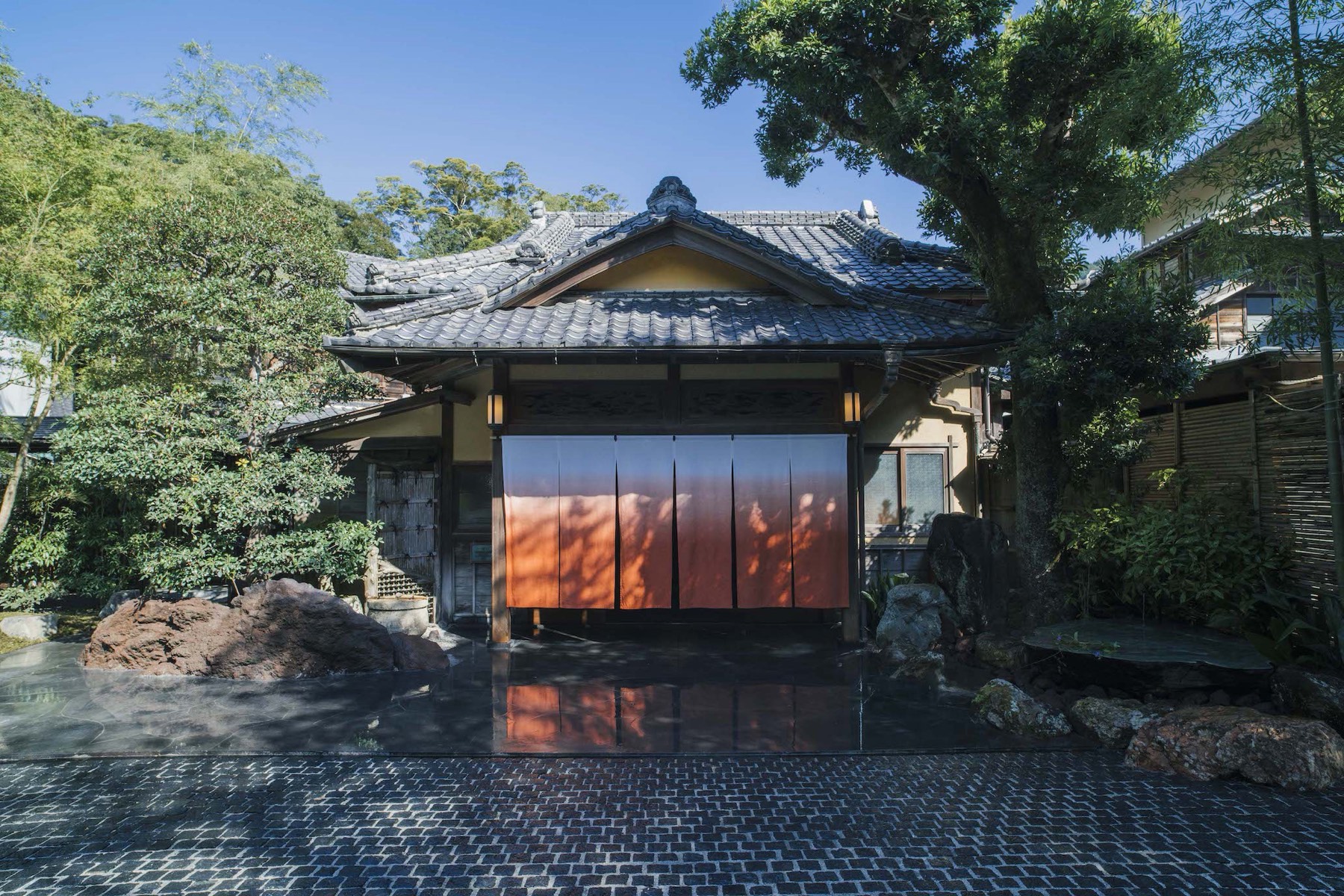 The entrance with its orange noren curtain